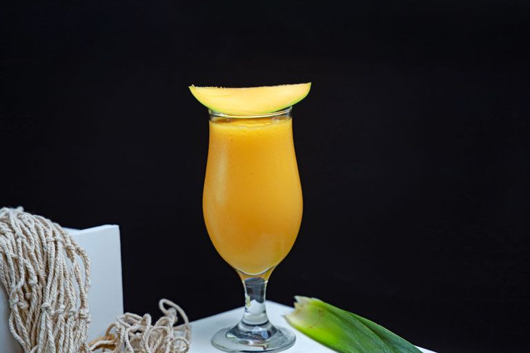 Vibrant mango smoothie served in a glass, perfect for a healthy refreshment.