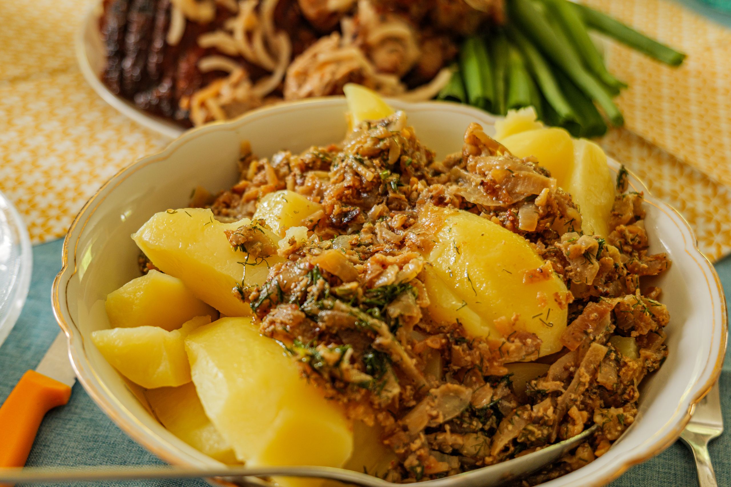 A delicious plate of German potatoes garnished with mixed herbs and spices, perfect for a hearty meal.
