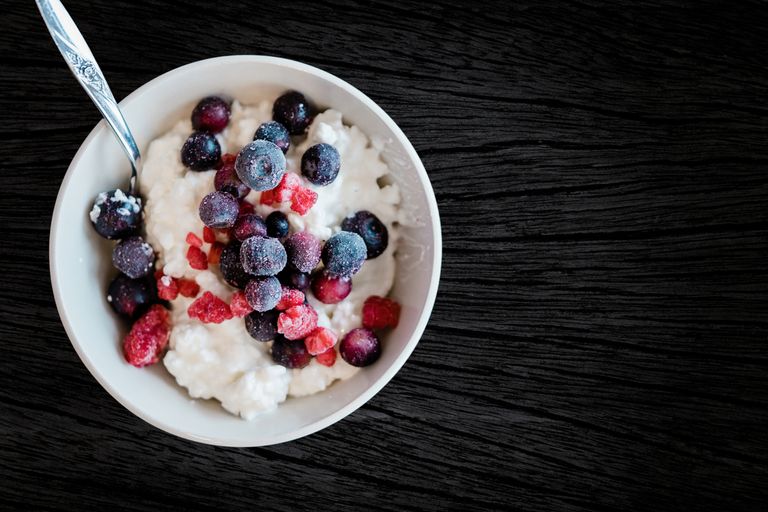 Enjoy a healthy breakfast with cottage cheese topped with fresh berries, perfect for a nutritious start.
