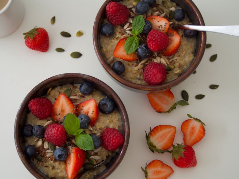Indulge in nutritious oatmeal topped with fresh berries for a healthy start to your day.