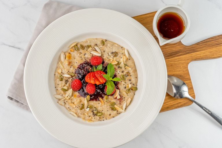 Top view of a nutritious breakfast bowl with berries and seeds, perfect for a healthy start.